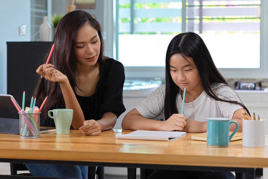 student and tutor together at a desk in Baltimore